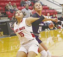 Jacksboro’s Rylee Mathis (11) works to get around the Eastland defender for a rebound during the Tigerettes’ loss Tuesday, Nov. 21. Photo/Brian Smith