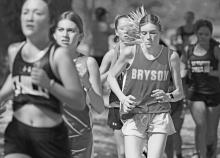 Bryson’s Joslyn Whitfill runs as an 8th grader during last year’s Lucy Park Invitational in Wichita Falls. Whitfill is now running as a freshman on the Cowgirls varsity cross country team. Photo/Kylie Bailey