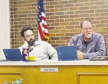 Jacksboro Alderman Joel Hood, right, speaks about the Tornado Long Term Recovery Committee while Alderman Stewart Chalmers listens during the Jacksboro City Council meeting Monday, Jan. 23. Photo/Brian Smith