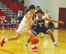 Tigers fall to Holliday, 50-37