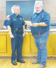 Jacksboro Mayor Craig Fenter, right, reads a city proclamation to Jacksboro Police Chief Scott Haynes in honor of National Police Officer Week. Photo/Brian Smith