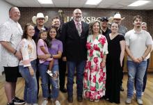 Jerry Penny and his wife Kelly, with family and friends after Penny is sworn in as Jacksboro police chief Monday. Photo/Ashley Anderson