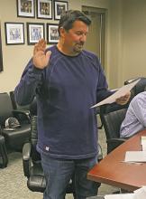 Bryson ISD board member Ronnie Collins is sworn in for another term during the Monday, May 22 board meeting. Photo/Brian Smith