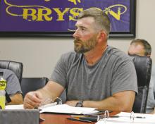 Bryson ISD school board members Blake Brooks and consider teacher payscales at the regular board meeting Monday, June 16. Photo/Ashley Barner