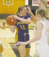 Bryson’s Kaylie Sherrin drives into the lane but is surrounded by Gordon defenders. The Cowgirls had a rough go of it Dec. 27-29 in the Gordon Tournament losing all of their games. Photo/Brian Smith