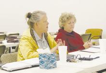 Case Manager Sandra Dixon talks about her cases and what her and fellow case manager Susan Coley, right, have been doing as part of the Long Term Recovery Committee meeting Thursday, March 23. Photo/Brian Smith