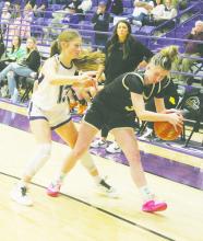 Starr Wesson (13) plays defense on the Henrietta player Friday, Jan. 17. The Tigerettes posted a 51-43 victory. Photo/Brian Smith