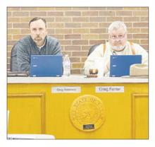 Place 3 Alderman Greg Robinson, left and Mayor Craig Fenter listen to an explanation during the Monday, Feb. 12 meeting. Photo/Brian Smith