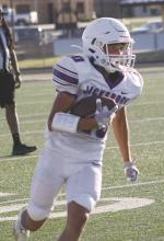 Jacksboro JV Purple’s Nathan Rockey looks for bit running room during first half action Thursday, Oct. 27 in Millsap. Rockey and his teammates won their eighth straight game and fourth straight in district with a 42-16 win over the Bulldogs. Jacksboro will go for a clean sweep in District 5-3A Division II play at 5 p.m. Thursday, Nov. 3 against Dublin. Photo/Brian Smith