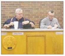 Mayor Craig Fenter, and aldermen Brandon Sisson look through their council packet during a Tuesday, Feb. 4 special called meeting. The council went into executive session and no action was taken. Photo/Brian Smith
