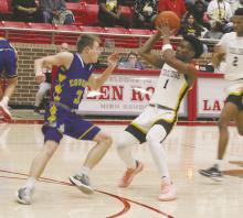 Jameson Pierce (3) blocks the way of the Coolidge player as part of first-half action during the Class A Division 2 regional final game Friday, Feb. 28. Photo/Brian Smith
