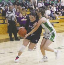 Landrie Valenzuela (3) muscles her way past the Iowa Park defender during first quarter action of Friday’s game against Iowa Park. The Tigerettes suffered a 38-34 loss, knocking them out of playoff contention. Photo/Brian Smith