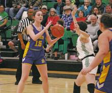 Eleanor Neudorf (15) looks for an open teammate during the Bryson Cowgirls’ loss Tuesday, Dec. 12 to the Newcastle Ladycats. Photo/TC Gordon