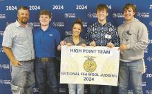 Perrin wool judging team members Joe Welch, Jaylee Holmes, Dillon Carter and Ryan Richeson and advisor Jacob Lange won the National FFA Wool Judging title Sunday, Oct. 20. The title is the first national title in the school’s history. Contributed photo
