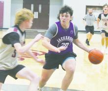 Jarrid English drives into the lane during a Poolville Summer League basketball game Thursday, June 20. English had 10 points in the 48-24 win over the Bulldogs. Photo/Brian Smith