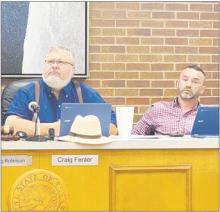 Jacksboro Mayor Craig Fenter, left, and Place 2 Alderman Brandon Sisson look at maps on a screen during the Sept. 11 city council meeting. The council directed P&amp;Z officials to look into rezoning the northwest side of the city. Photo/Brian Smith