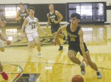 Perrin junior Jack McCormick (10) drives into the lane during first half action in the Wednesday, Nov. 22 game in Alvord. McCormick scored 32 points in the first half enroute to a 41-point game in helping the Pirates remain unbeaten with a win. Photo/Brian Smith