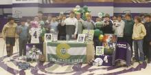 Cannon Valenzuela, center, poses with his football teammates. Valenzuela signed a national letter of intent Wednesday, Dec. 4 to play football for Colorado State University. Photo/Brian Smith