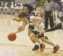 Tyler Roberts(10) battles for the loose ball during Jacksboro’s 60-45 win Friday, Feb. 7 over Vernon. Photo/Brian Smith