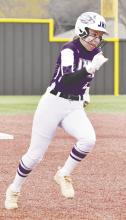 Emma Lee Gray runs the bases during the March 20 game in Henrietta. The Lady ‘Cats broke things open in the third and went on to a 14-9 victory over the Tigerettes. Contributed photo