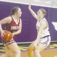 Jacksboro’s JV Tigerettes opened the sweep of Poolville with a 55-2 victory Tuesday, Dec. 5. The Lady Monarchs avoiding the shutout with 1:05 left in the game. Here, Mackenzlie Breger, right, plays defense on the Poolville player Photo/Brian Smith