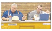 Jacksboro Mayor Craig Fenter and Alderman Brandon Sisson look over a proposal to require all animals adopted from the animal shelter be spayed or neutered. Photo/Brian Smith