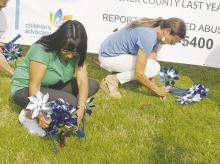 A pinwheel planting Tuesday, April 1 was hosted on the courthouse lawn in honor of Jack County children who were abused during the 2024 calendar year. More than 70 children were abused countywide. Photo/Brian Smith
