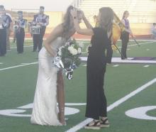 Jacksboro High School senior Brailyn Tullous was selected as Homecoming Queen during a pregame ceremony Friday, Sept. 13 before the game with Peaster. She is crowned by her mother. Photo/Brian Smith