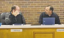 Jacksboro aldermen Joel Hood, left, and Greg Robinson discuss the council agenda for the Monday, Jan. 13 meeting. Aldermen listened to concerns residents had about the city’s police department. Photo/Brian Smith