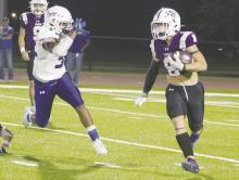 Luke Sams looks for running room against City View. Sams rushed for two touchdowns but the Tigers suffered a 28-21 overtime loss to the Mustangs. Photo/Brian Smith