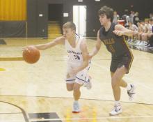 Bryson junior Jameson Pierce drives inside during a first round game with Bells in the Gordon Tournament. The Cowboys suffered a 79-22 loss to the Class 3A Panthers. Photo/Brian Smith