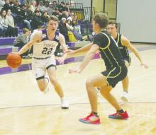 Eli Jonas (22) drives inside for Jacksboro. Jonas and the Tigers defeated Henrietta 60-53 in a District 7-3A game. Photo/Brian Smith