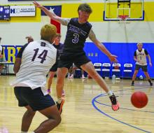 Tyler Roberts jumps to block a pass from a Wichita Falls Legacy player during a summer league matchup Tuesday, June 24. Photo/Brian Smith