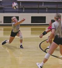 Emma Gray (12) bumps a return while both Avery Bennett, center, and Kylie Tullous came in to help during the Oct. 5 match with Vernon. The Tigerettes lost a five-game thriller to the Lady Lions. Photo/Brian Smith