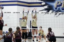 Baylee Meadows (Left) and Kannan Collier (Right) go up for a block. Meadows was key defensively at the front of the net. JHG file photo