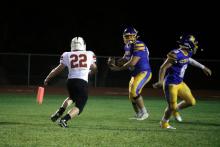 Ben Bennett drops back to throw for the Bryson Cowboys in their matchup. Bennett caught the lone touchdown pass on the evening for Bryson. Photo/Ashley Anderson