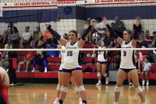 Brooke Reaves, 15, and Lyla Brown, 9, stand ready defensively on a serve receive attempt for Jacksboro. Archive photo