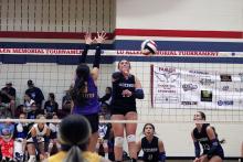 Brookes Reaves tips a ball over the net at the Lu Allen tournament Friday, Aug. 22. Reaves serves as one of the primary playmakers for the Tigerettes. JHG file photo