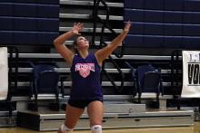 Brooke Reaves lines up for a serve Friday, Aug. 8. Reaves played a vital part in the passing and defensive game for the Tigerettes in their win against the Lady Dragons. 