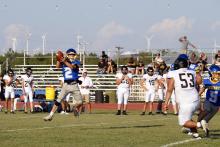Canton Scobee takes a ball for a run play Thursday, Aug. 14. Overall, coach Kevin Ray was pleased with the team’s effort. Photo/Ashley Anderson
