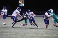 Cole Keeney breaks away from defenders on a run Friday, Oct. 10. The Pirates lost to the Bobcats 53-14 on this day.  Photo/Ashley Anderson