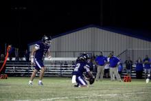 Cole Keeney, 1, and Riley Sims, 2, line the ball up for a kick Thursday, Sept. 18. The Pirates blew out the Covington Owls 68-20.  Photo/Ashley Anderson