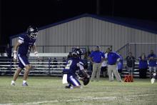 Cole Keeney, 1, prepares to kick a ball through the uprights set up by Riley Sims, 2. Keeney was pivotal in the ground game in the Pirates’ win. Archive photo