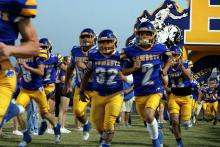 The Bryson Cowboys run out of the tunnel for one of their home games this season. The Bryson Cowboys will take on the Knox City Greyhounds in a matchup Friday, Oct. 24. Photo/Ashley Anderson
