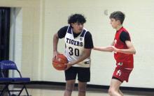 Gio Aldada looks to pass the ball in one of the Tigers fall league matchups. The Tigers defeated the Alvarado Indians 62-61 in a shootout Monday, Nov. 24. Photo/Alex Havardansky