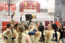 The Lady Pirates celebrate with their area championship trophy Tuesday, Nov. 4. A total of nine players for the Lady Pirates were honored with district awards. Photo/Alex Havardansky