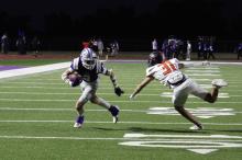 Issak Wesson runs away from a defender in one of the Tigers’ matchups. Wesson caught a touchdown pass in the Tigers 54-7 victory over the Millsap Bulldogs in their game Friday, Oct. 17. Photo/Ashley Anderson