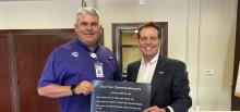 Jacksboro ISD Superintendent Brad Burnett accepts Ten Commandments posters from Sen. Brent Hagenbuch in September, aligning with requirements in Senate Bill 10 which says the text must be displayed in all Texas public school classrooms. Contributed photo