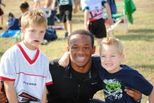 Jacksboro varsity sports athlete takes a photo with two of his junior Tigers. This is part of the JR-T program where junior Tigers and Tigerettes are paired up with varsity players in Jacksboro leading to a support system for both. Contributed Photo/Cheryl Hubble