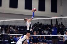 Joslyn Whitfill swings for a kill in a tournament match. Whitfill led the team in kills against Bellevue with eight Tuesday, Aug. 19. Photo/Alex Havardansky